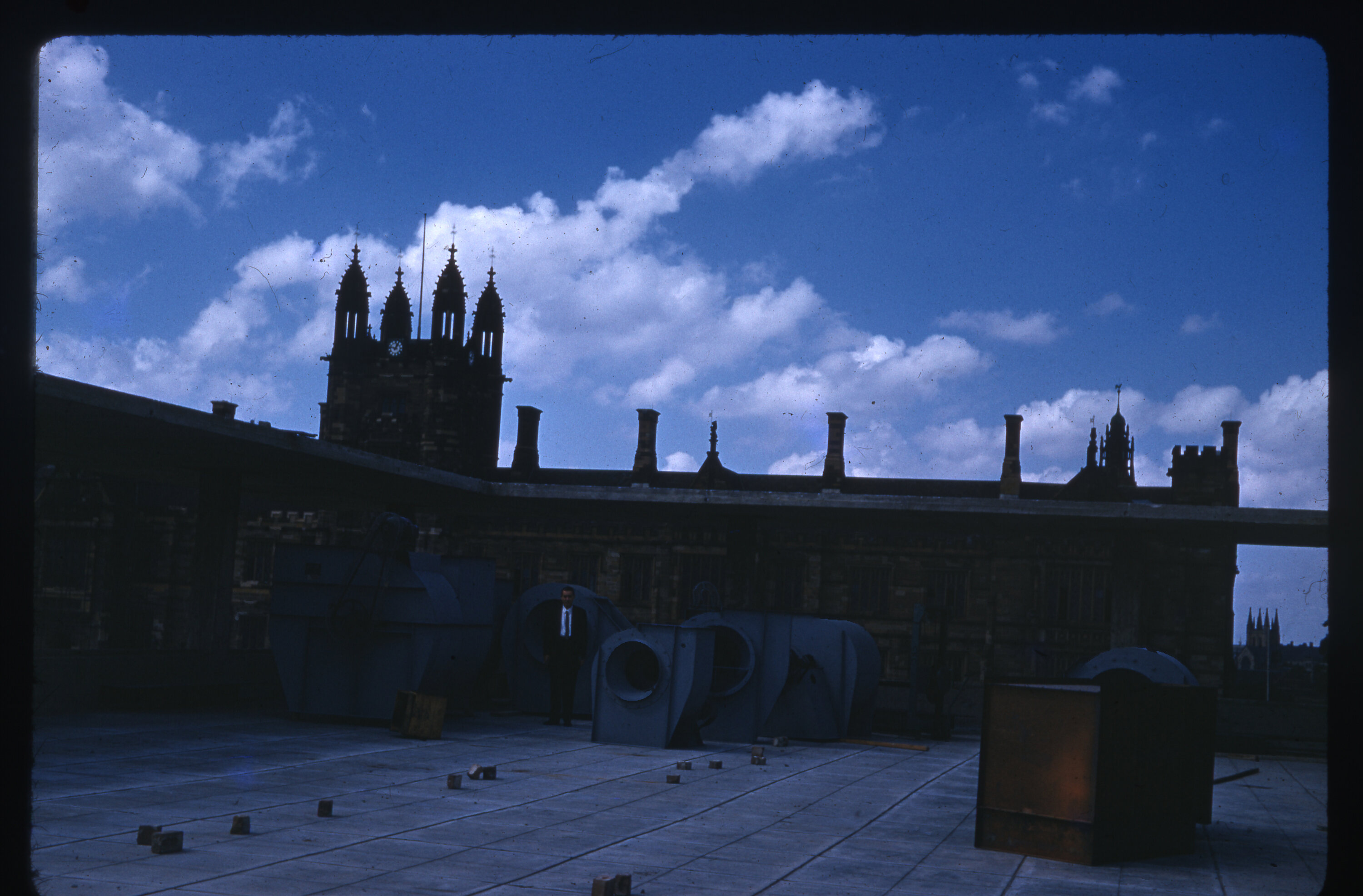 Person atop Fisher Library construction site