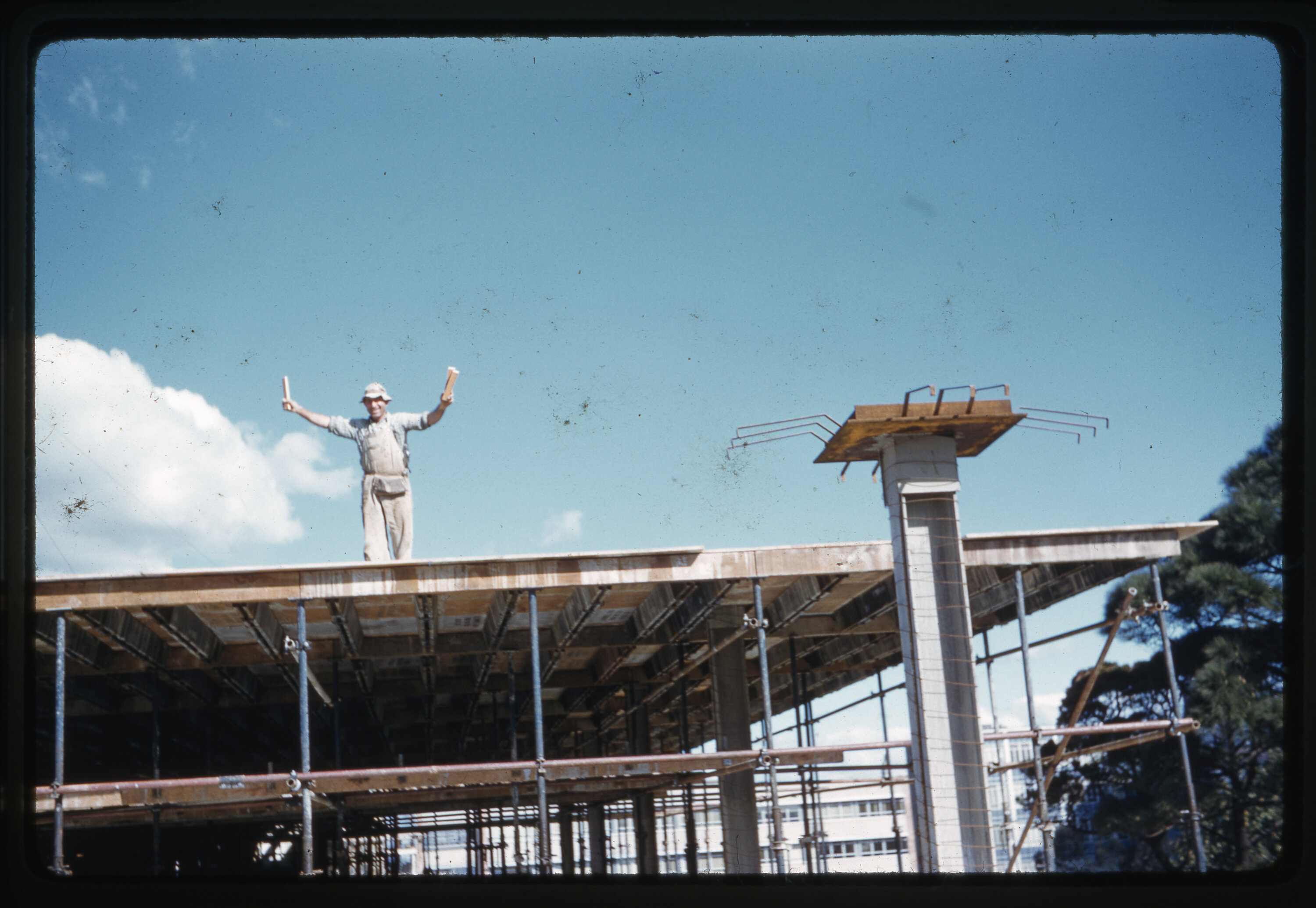 Worker atop library construction site