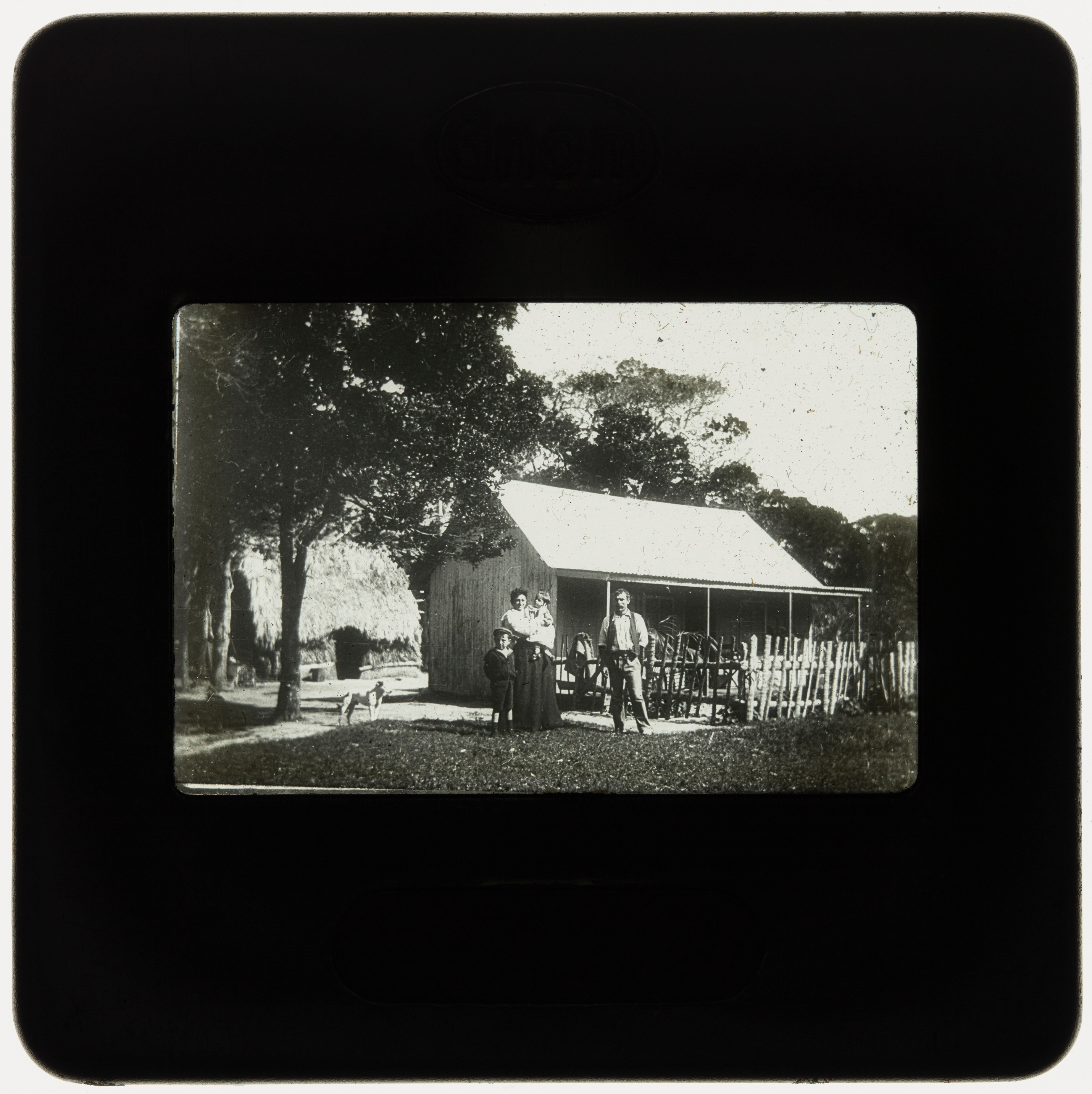 Portrait of family in front of house, Lord Howe Island