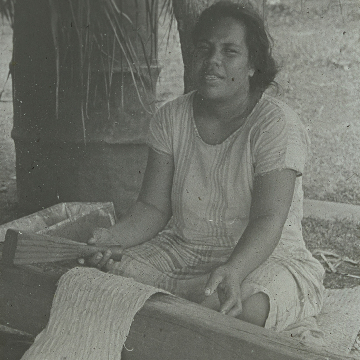 Person working with fabric, Vavaʻu (Tonga)