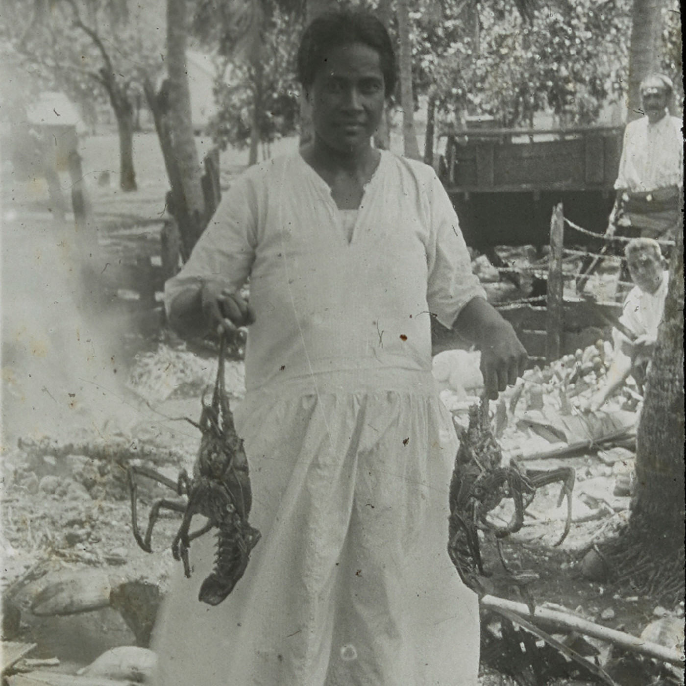 Person with lobsters, Namuka in Tonga