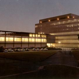 Fisher Library at night. viewed from in front of clock tower of main quadrangle.