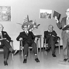 Hermann Black, Bruce Williams, Harrison Bryan, and Walter Stone (speaker) in the Fisher Library Common Room