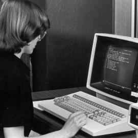 Barbara Wilson, with the Fisher Library Computer Visual Display Unit (VDU) for Australian Bibliographic Network (ABN)