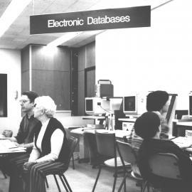 Creagh Cole assisting library users with the Fisher Library New Electronic Databases