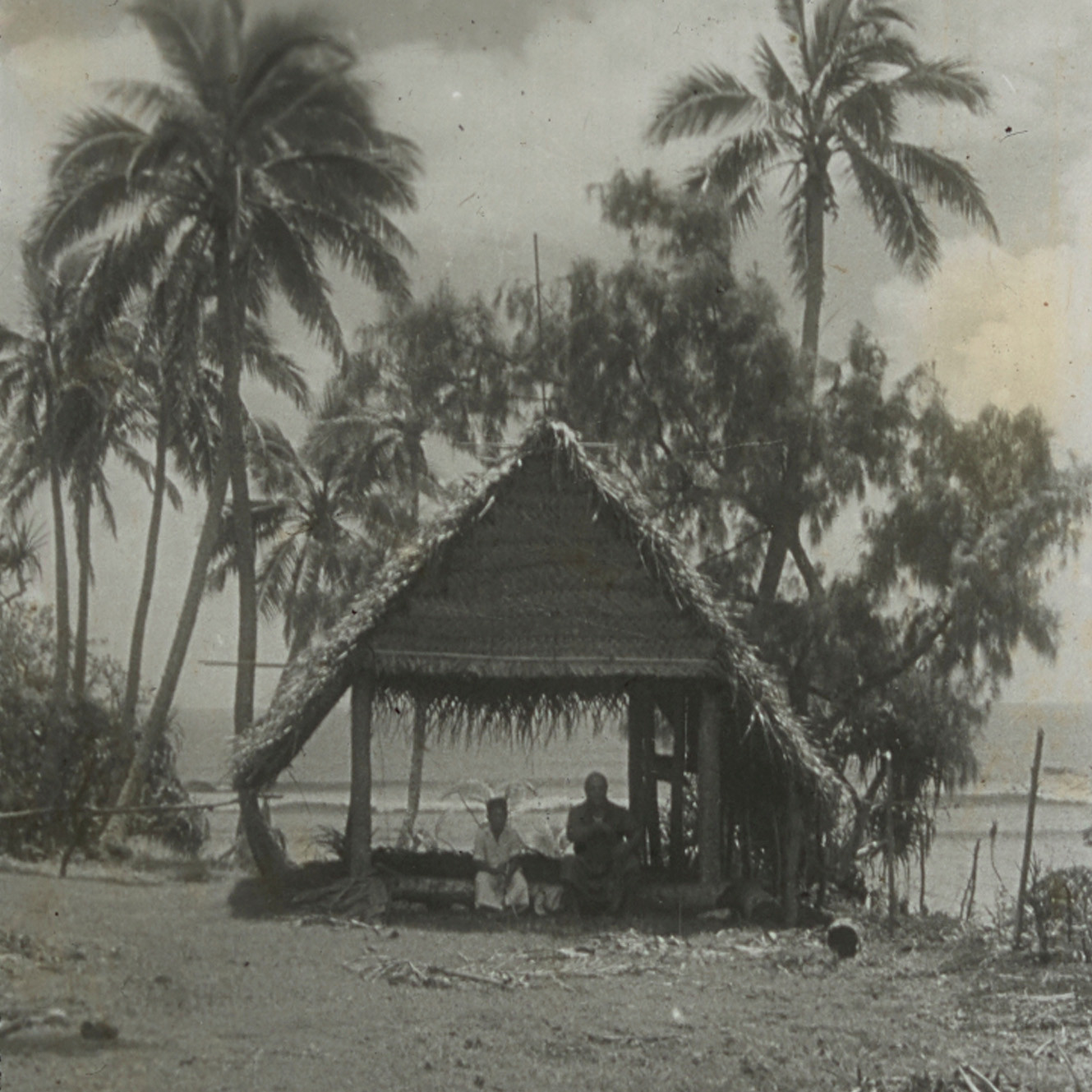 People in traditional hut, Hihifo