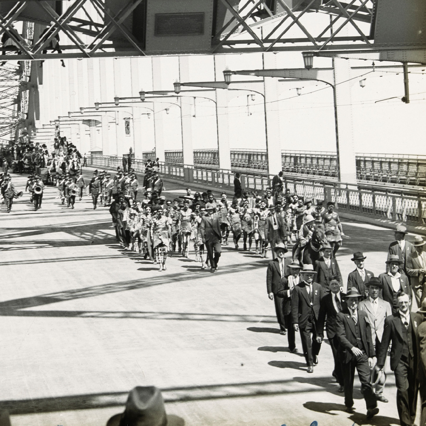 Procession crossing Sydney Harbour Bridge after official opening (1932)