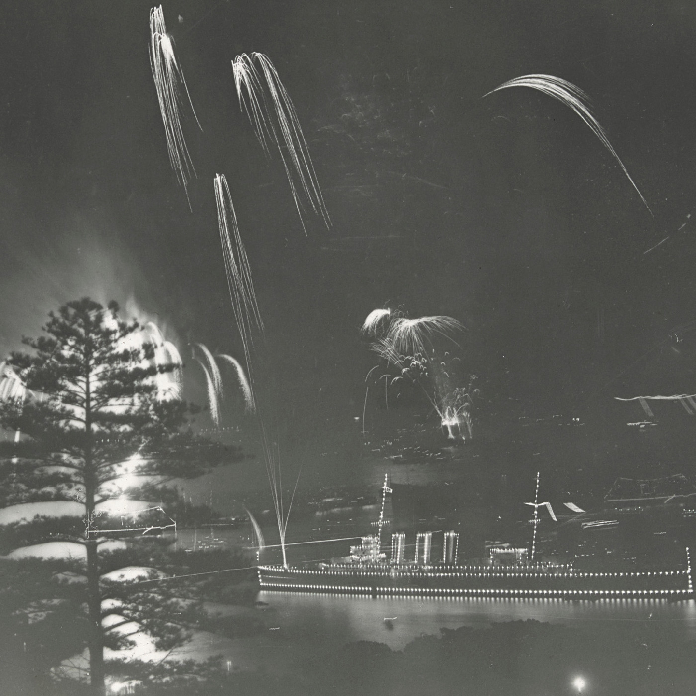 Fireworks and boats decorated with lights at official celebrations for the opening of Sydney Harbour Bridge (1932)