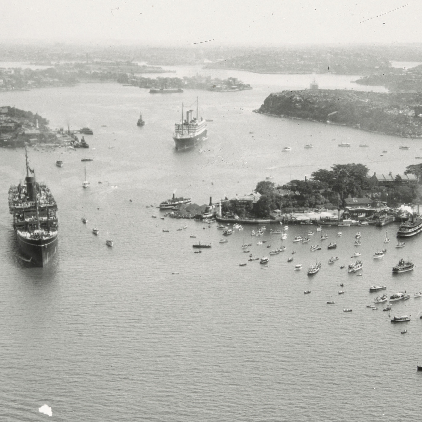 Aerial shot of water pageant during Sydney Harbour Bridge celebrations (1932)