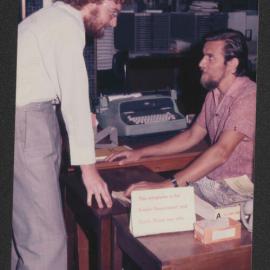 Student receiving support, Fisher Library, 1977