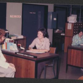 Student with enquiry for Library staff member, Fisher Library, 1977