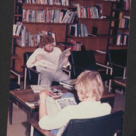 Students using the casual reading area, Fisher Library, 1977