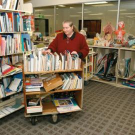 Library staff member with trolley, 2002