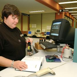 Library staff member processing book, Engineering Library, 2002