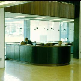 Ray Sowden at the charging desk, Fisher Library, 1963