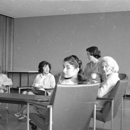 Library staff members seated in Fisher Library Staff Room
