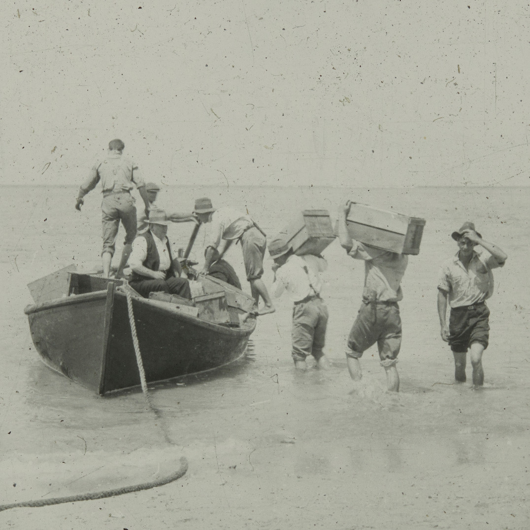 Boxes loaded onto a small rowboat, Lord Howe Island